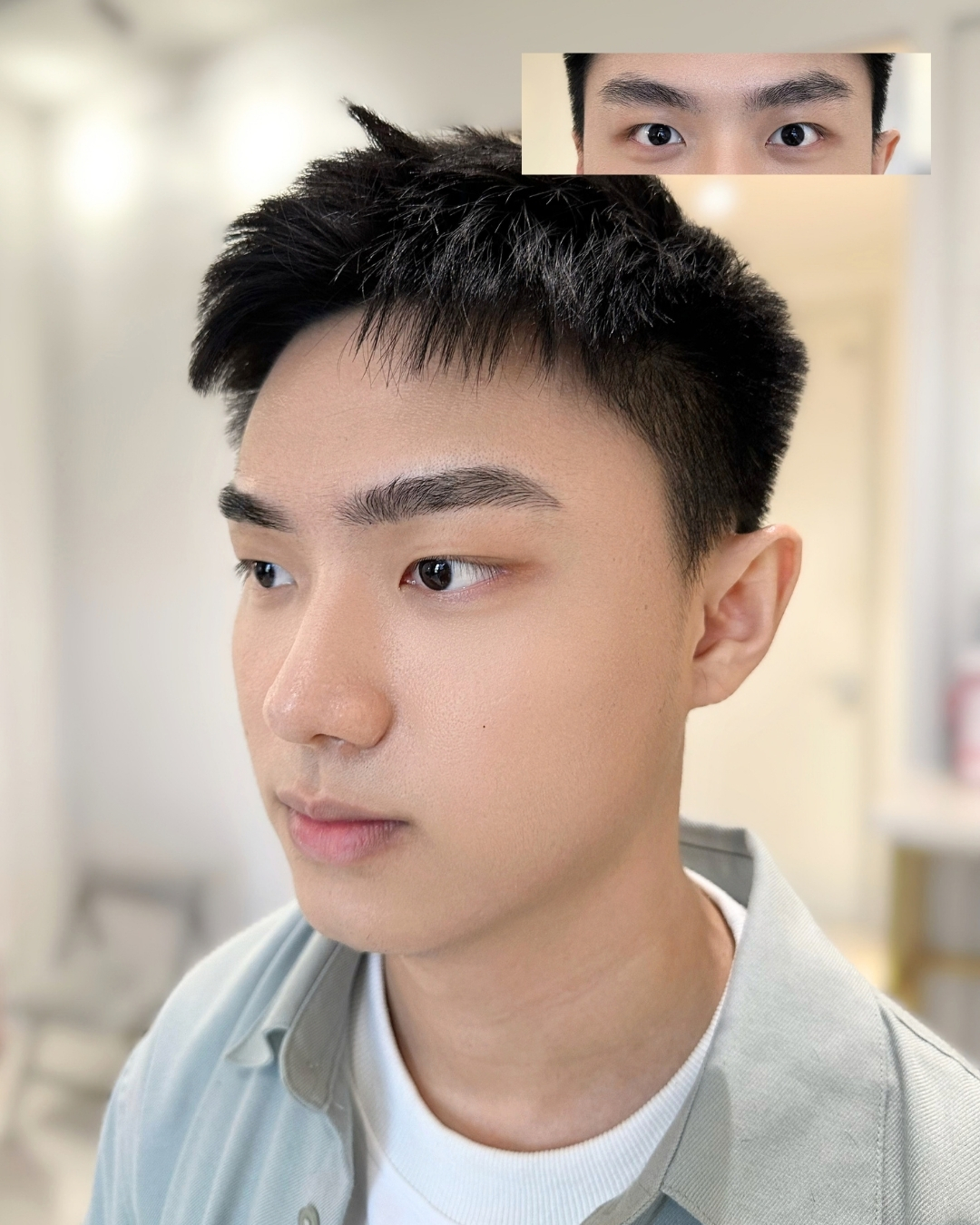 Brow De Art male client with defined brows, wearing a light overshirt